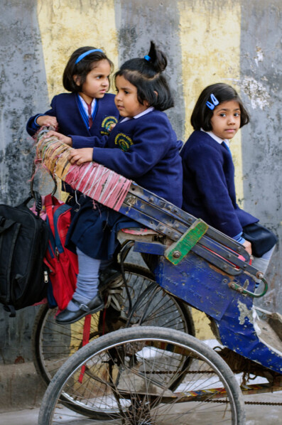 A rickshaw full of schoolgirls in India