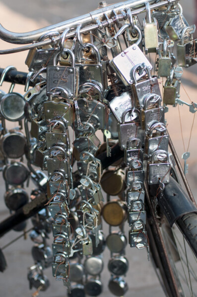 Locks hang over the handlebars of a bicycle in India
