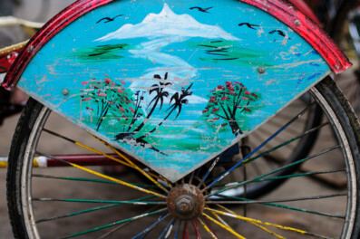A mountain is painted on a rickshaw in Nepal