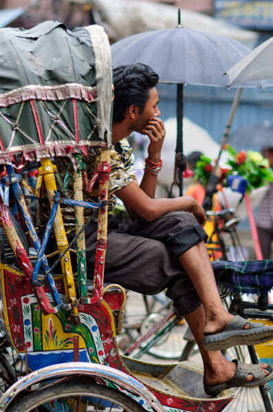A rickshaw chauffeur waits for customers in Nepal