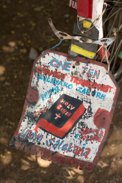 A bible is painted on a bicycle mud fender in Africa