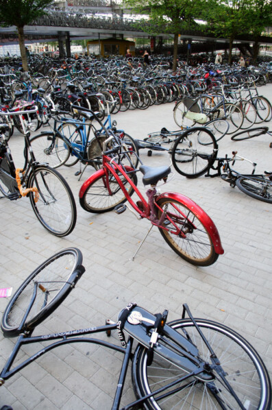 Bicycles are chaotically parked near Amsterdam central station. Bicycles are chaotically parked near Amsterdam central station. Bicycles are chaotically parked near Amsterdam central station.