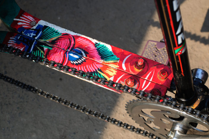 A rickshaw frame is painted with flowers in Bangladesh