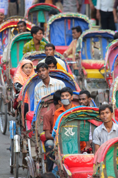 Dhaka cycle rickshaws sit in a traffic jam