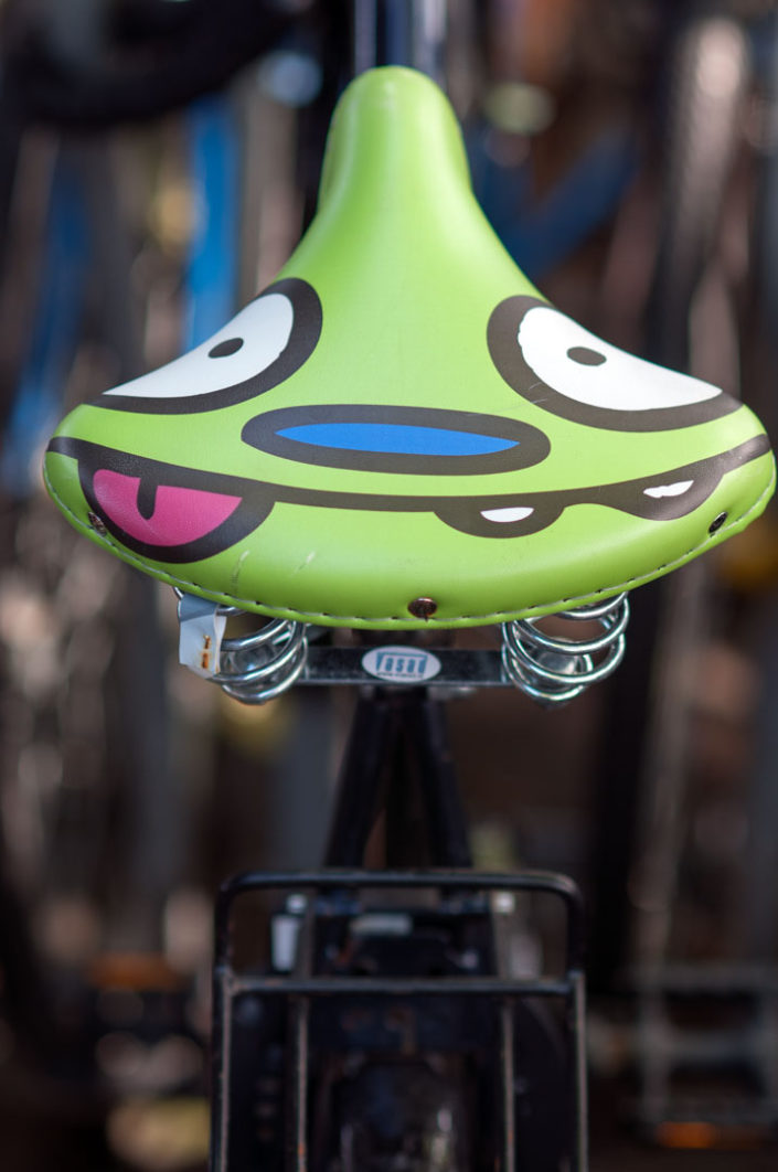 A Bicycle seat has a funny face on it in Amsterdam