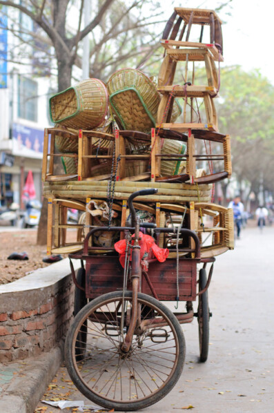 A cargo bike full of rotan furniture in China