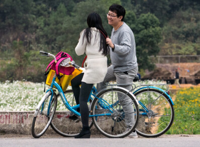 Chinese tourists riding their bicycles