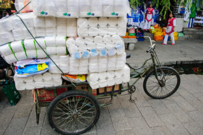 A cargo bike in Dali, China is loaded up with toilet paper.