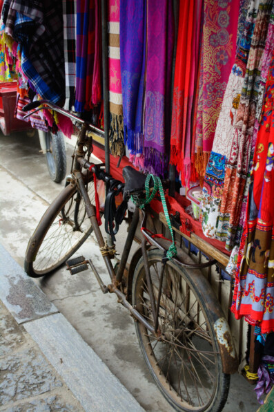 A bicycle holds a rack full of clothes in China