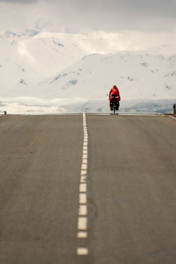 A touring cyclist heads toward the Parmir mountains.
