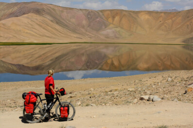 A cyclist looks over Bulun Kul in Tajikistan.