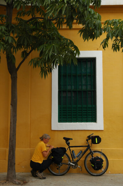 A cyclist loads their panniers in Pondicherry, India
