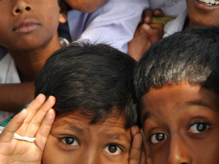 Kids pull faces in India.
