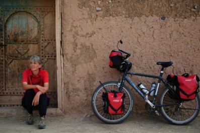 A touring bicycle is leaned against a wall in Morocco