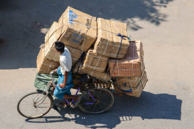 An overloaded trishaw in Myanmar