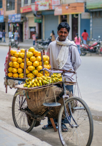 World bicycle culture - a fruit salesman&#039;s bike is loaded with bananas and oranges in Nepal.
