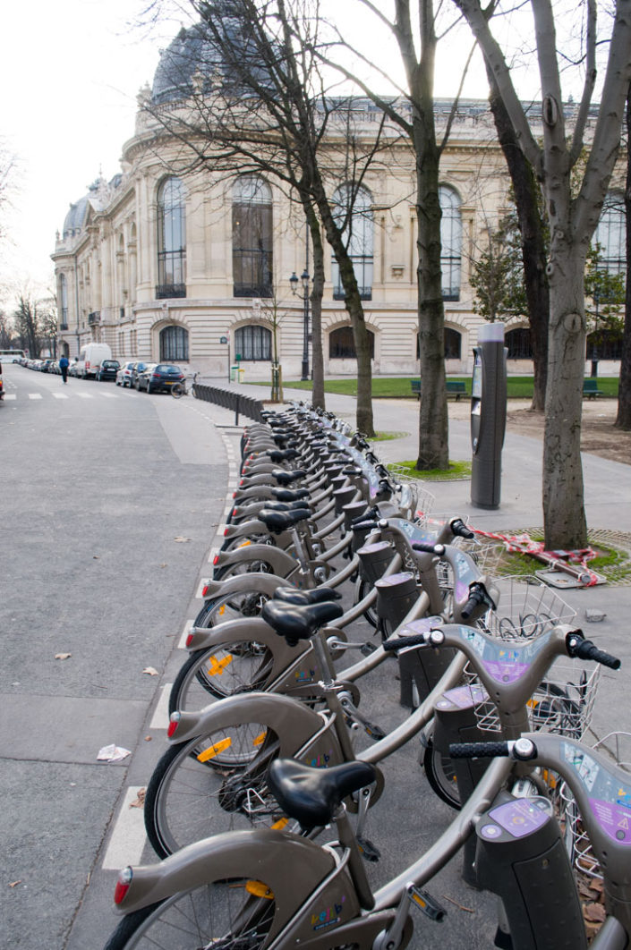 Rental bikes are parked in the historic distric of Paris, France