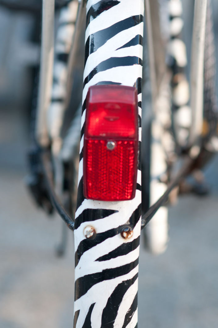 Zebra stripes are painted on the fender of a Dutch bike.