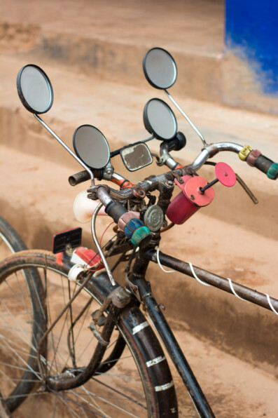 A bicycle in East Africa is decorated with multiple mirrors.