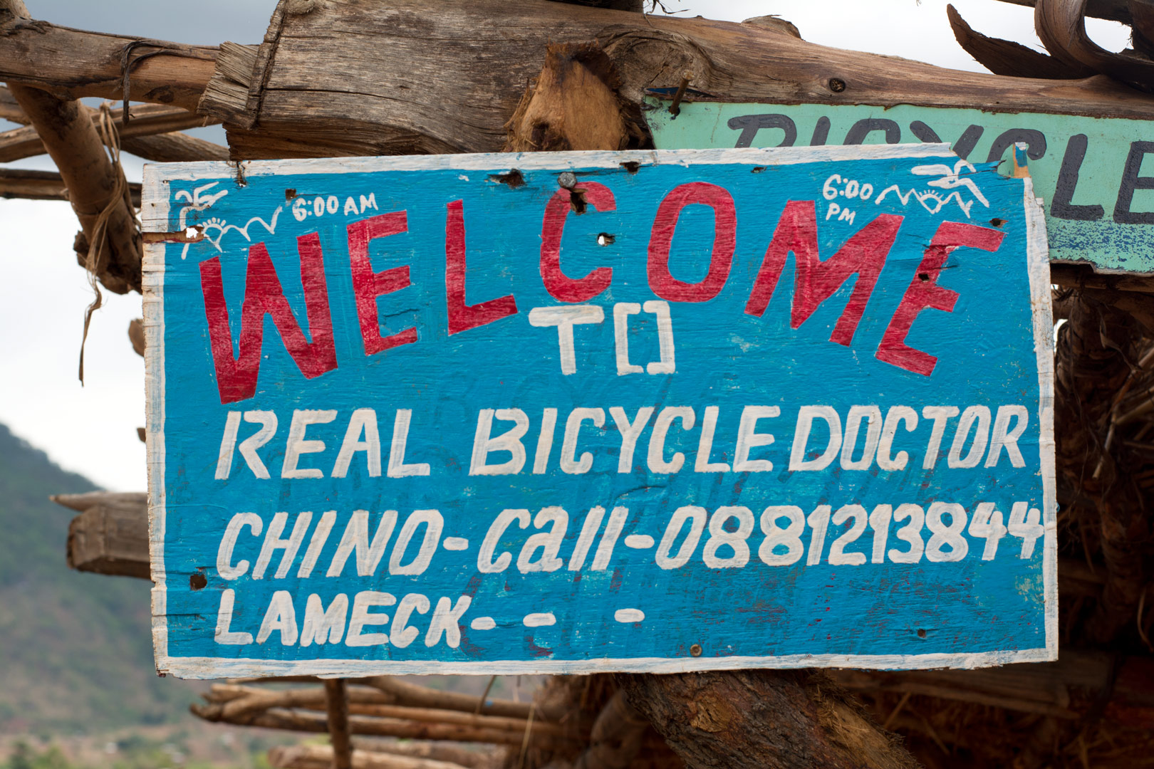 A sign advertising a real bicycle doctor in Africa