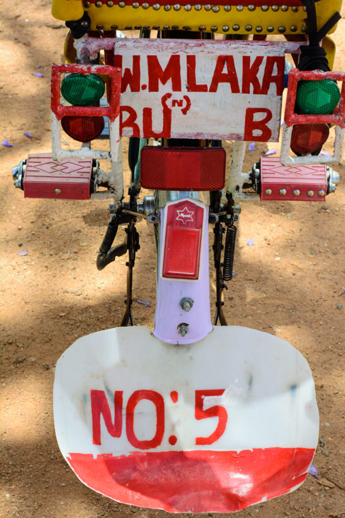 A decorated bicycle in Africa with a mudflap