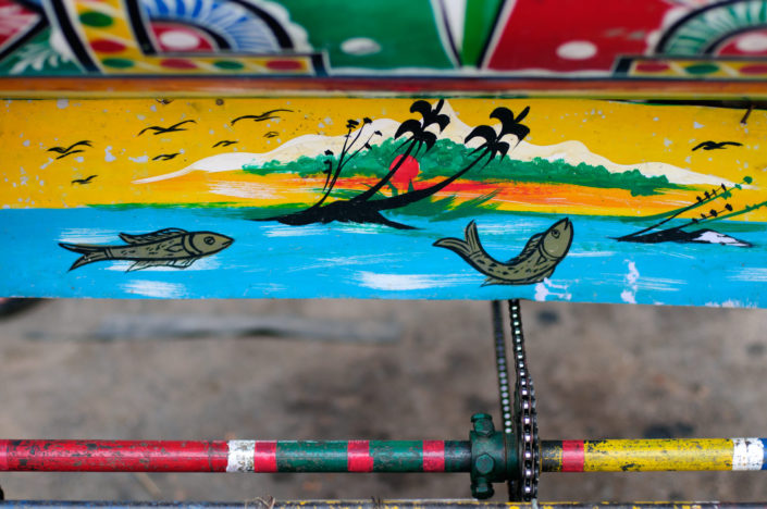 Rickshaw body is painted with a mountain view in Kathmandu, Nepal.
