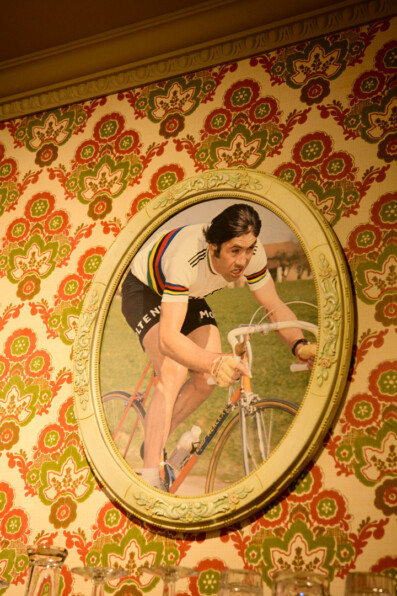 A photo of cyclist Eddy Merckx adorns a wall in Oudenaarde, Belgium.
